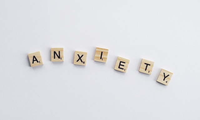 the word anxiety written in scrabble letters